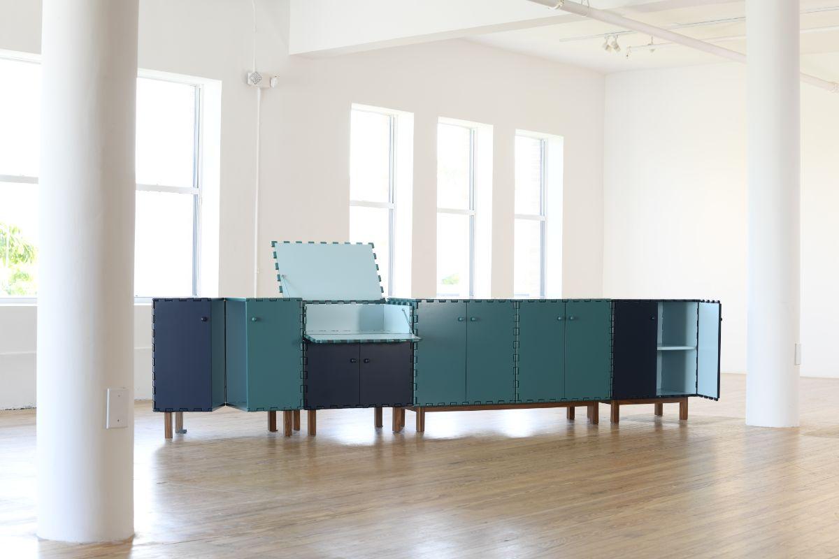 Tangara sideboard set by Luis Pons
Dimensions: W 259 x D 44 x H 95.5 cm
Materials: metal, rosewood, wood, bronzed, walnut, hand-crafted, lacquared

Tangara envisions a new meaning for the wood hinge, a feature that was previously crafted by