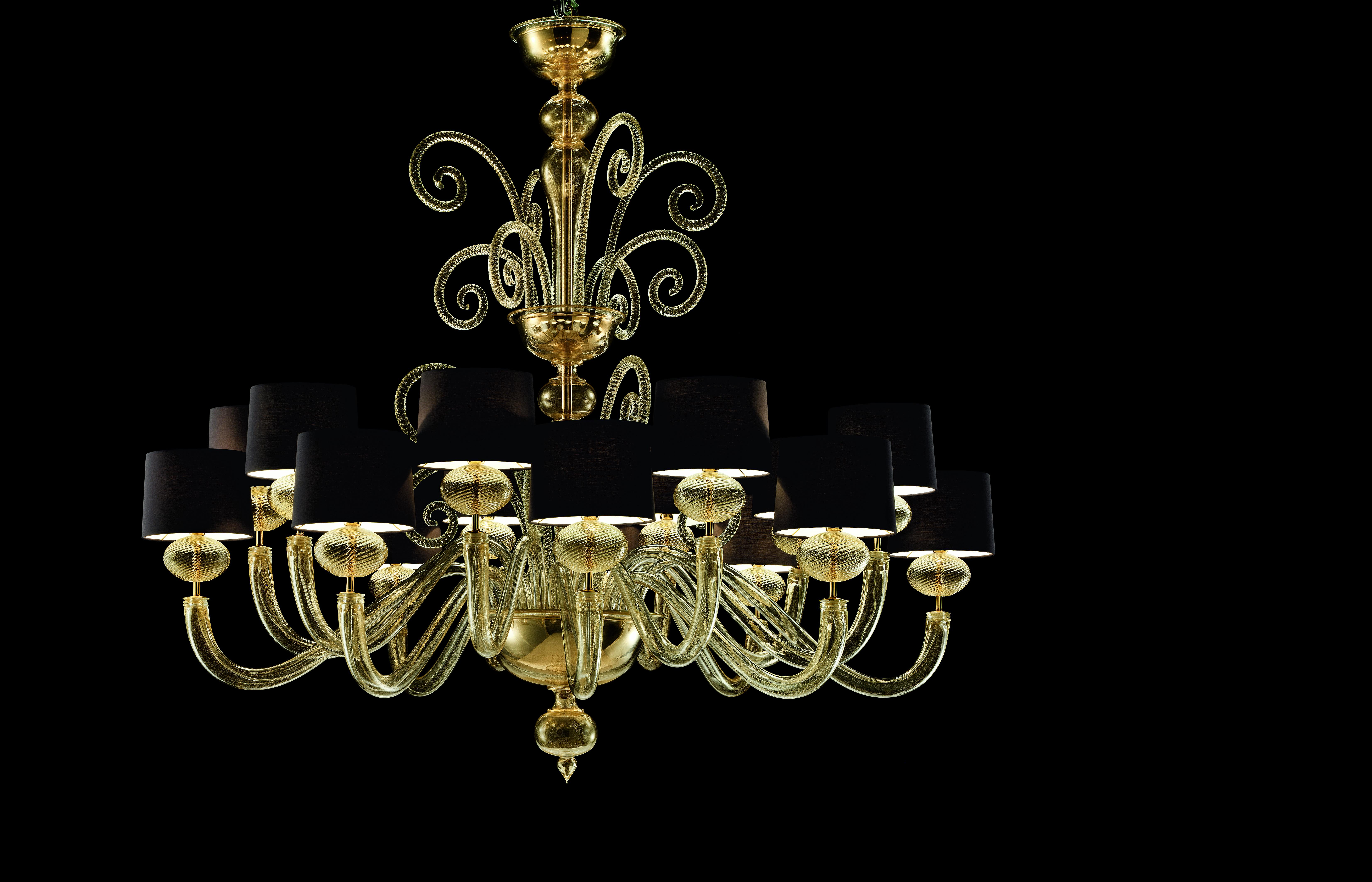 Shown here is the Tangeri 5604 16 Chandelier in Gold Glass and Galvanized Gold Finish, with a Black Shade. The light collection was inspired by the palaces and emotions of sunset in Morocco, Tangeri is a collection of three crystal chandeliers