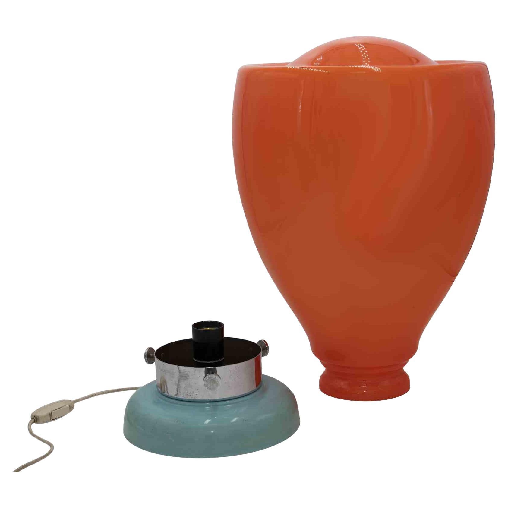 Tangerine Murano glass lamp is an original design lamp realized by Italian designer in the 1970s.

A very beautiful lamp with orange Murano glass lampshade and turquoise base (with some scratches).

Collect a unique lamp and give a touch of