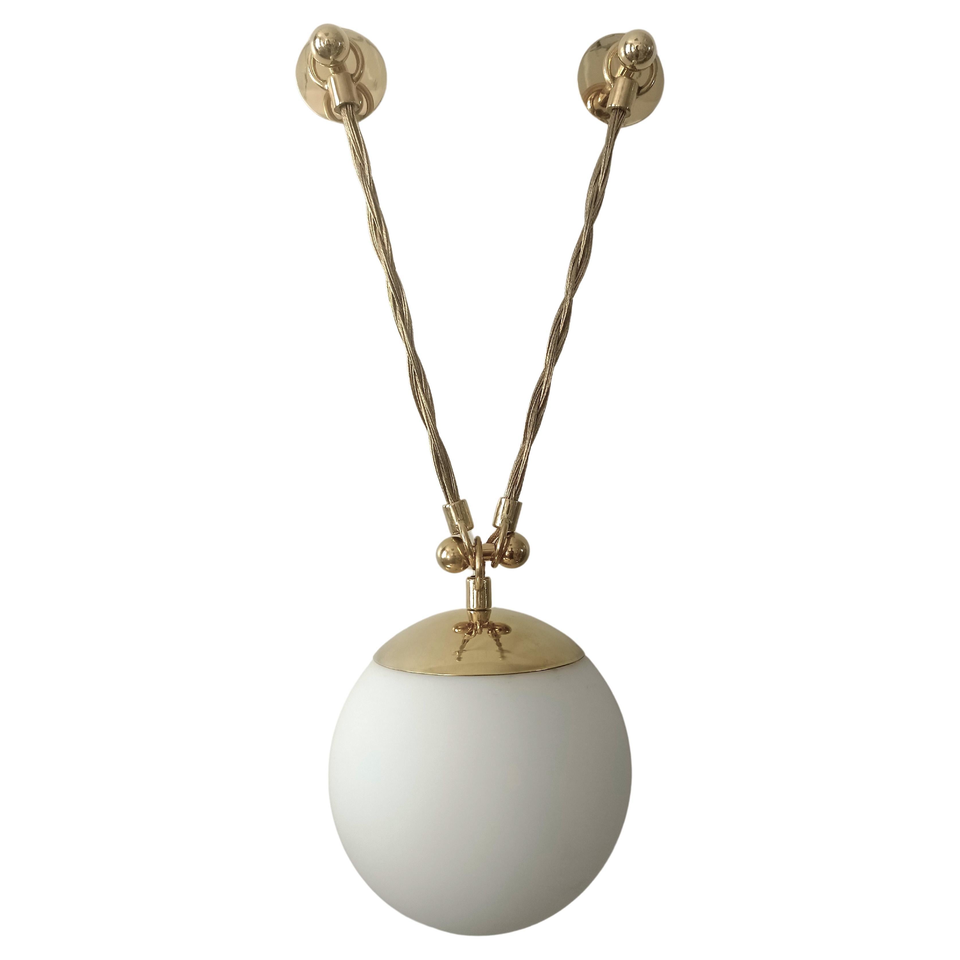 Tangled - wall sconce version. 
Brass plated wires and opaline glass. 

Lamping: LED 2700/3000K.
Power cable runs within one of the holding arms (you may select).
 
Custimizations available (dimensions, glass) on demand.
Attached images of example