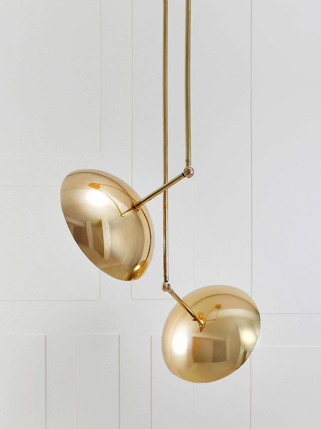 Tango II, sculpted pendant by Paul Matter
Blackened brass with aged brass details.
Shade in blackened brass (also available in aged brass)
Exterior and aged interiors.
Dimensions: W 38 x D 38 x H 148 cm

Tango is born from playful