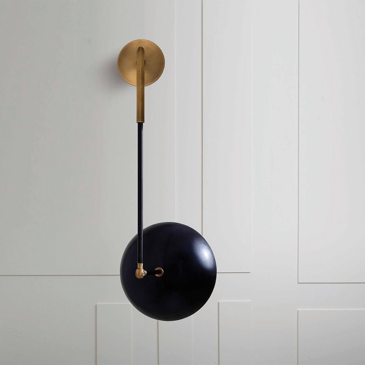 Tango sconce by Paul Matter
Dimensions: W 30 x D 30 x H 73 cm
Materials: Brass.
Available in different finishes.

Tango is born from playful experimentation with vintage lighting components.
Burnt, aged brass and etched glass are combined to