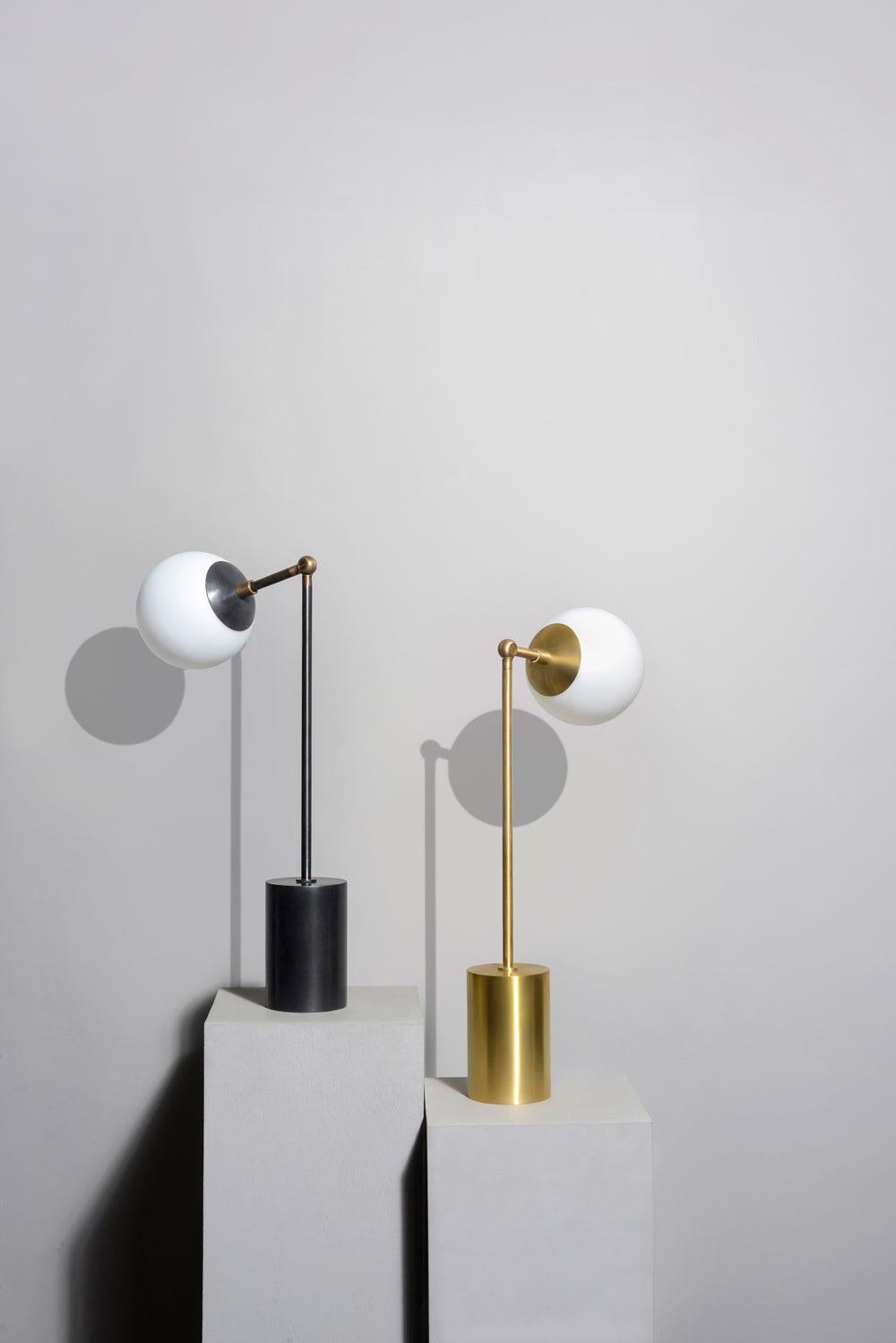 Tango is born from playful experimentation with vintage lighting components to create lighting fixtures that fuse sculptural form with hand-worn materials. Articulating elbows and brass shades create a sophisticated armature that emits soft pools of