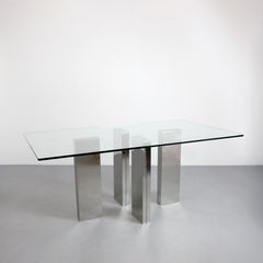 "Tania" dining table with tempered glass top on four chromed steel columns