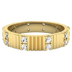 Diamante Tanisa Nahata 0,27ct. Anello a fascia per l'eternità con pilastri scanalati in oro 18 carati.