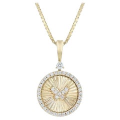 Tanisa Nahata Diamant papillon 0,309ct. Pendentif en or jaune 18 carats.