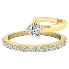 Diamante Tanisa Nahata 0.40ct. Anillo de banda y media en oro de 18 quilates.
