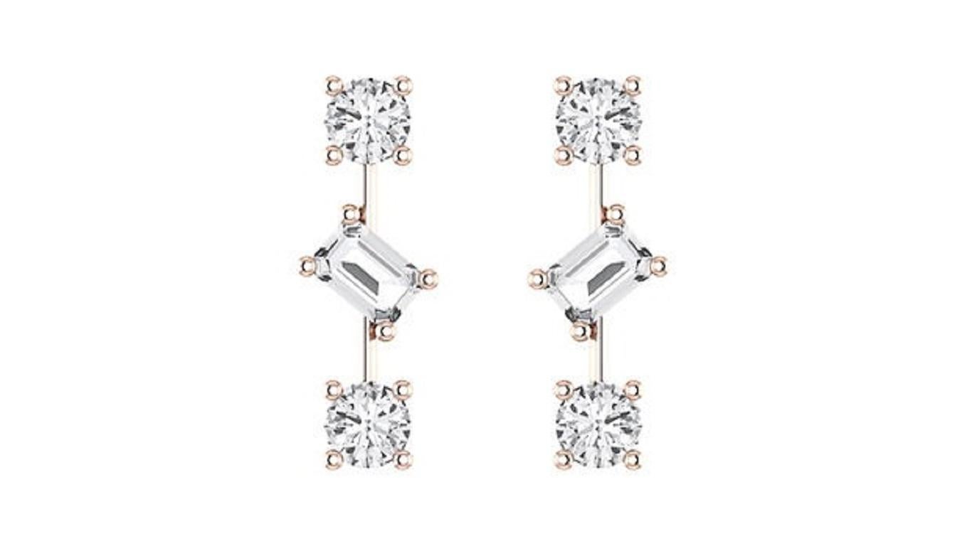 These exquisite stud earrings feature vibrant emeralds paired with round-cut diamonds, all set in your choice of 18K white, yellow, or rose gold. Designed to capture elegance with a touch of color, the earrings make a versatile addition to any