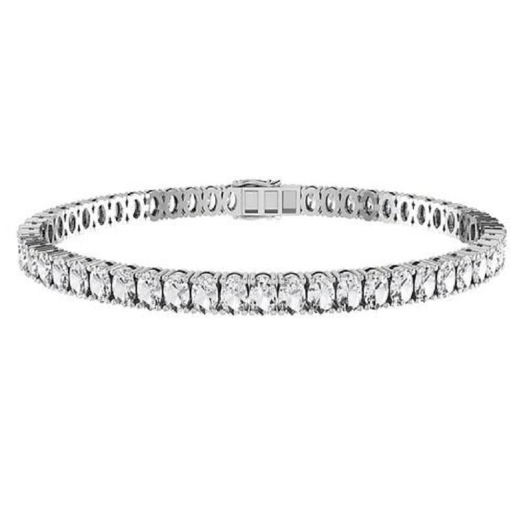 This stunning oval shape diamond tennis bracelet features a continuous row of sparkling diamonds set in luxurious 18-karat gold. Each oval diamond is meticulously crafted to enhance its brilliance, creating a seamless and elegant design that exudes