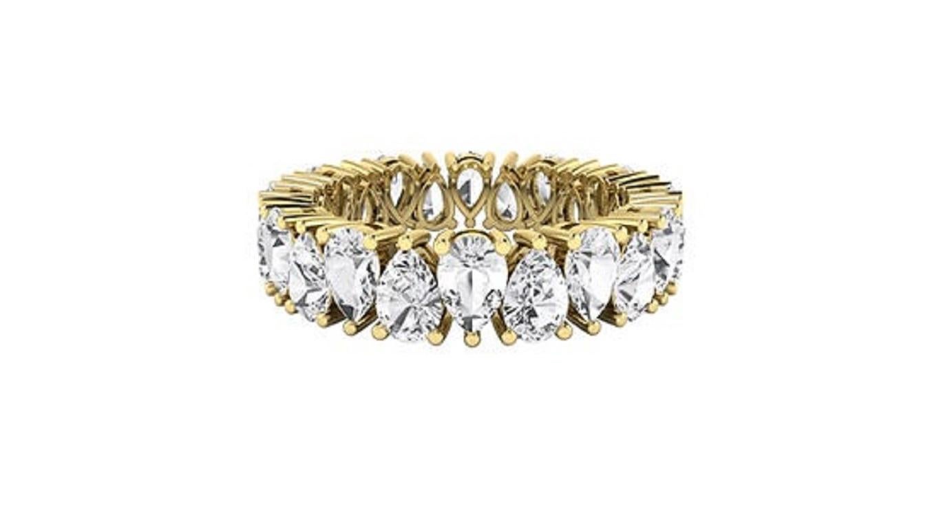 Introducing the Diamond Twin Pear Eternity Fancy Ring, a timeless design in 18Karat gold available in white, yellow, and rose variations. This elegant piece features two pear-shaped diamonds facing each other, symbolizing harmony and balance, all