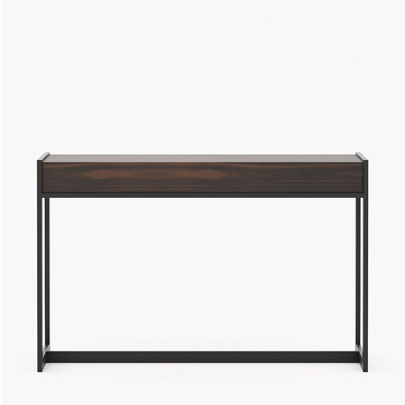 Console table Tanja wood with smocked eucalyptus veneer top and
with steel structure in black matte finish.
Also available on request in ebony matte finish, or grey oak matte finish,
or natural oak finish, or rosewood matte finish, or in walnut