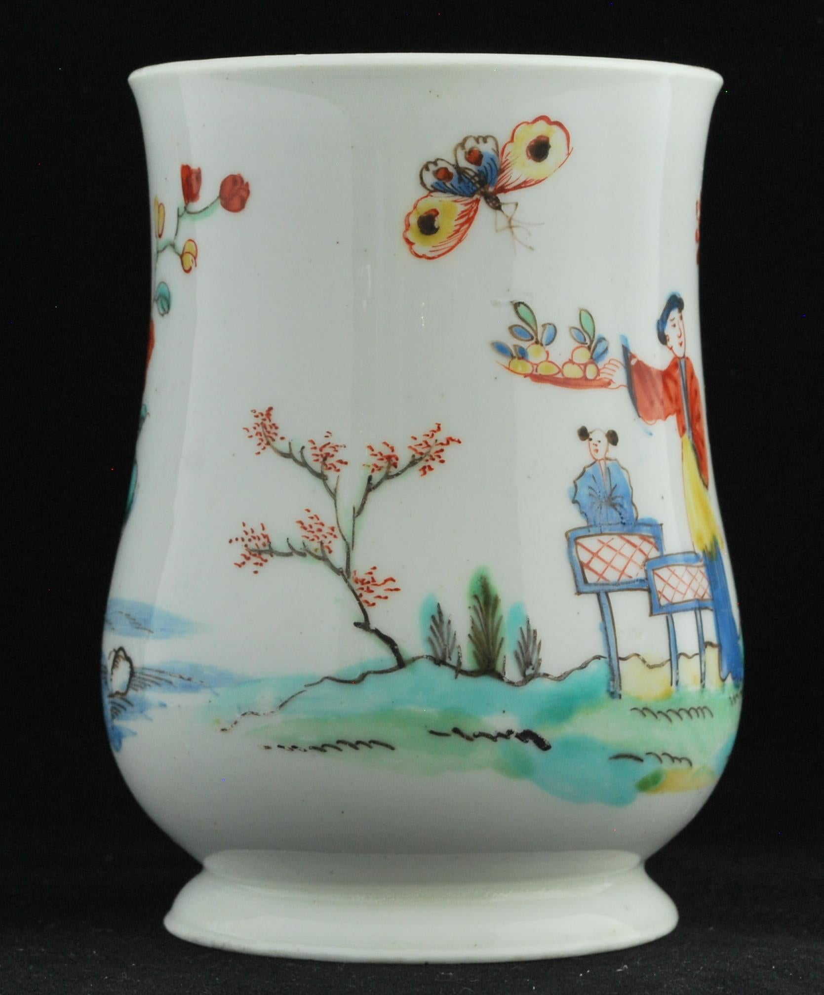 Baluster-shaped tankard, decorated with a pattern taken form the Chinese, in the famille rose-verte palette. It is amusing to note how the house on a hill in the original has been merged into a branch in the foreground, resulting in a curious