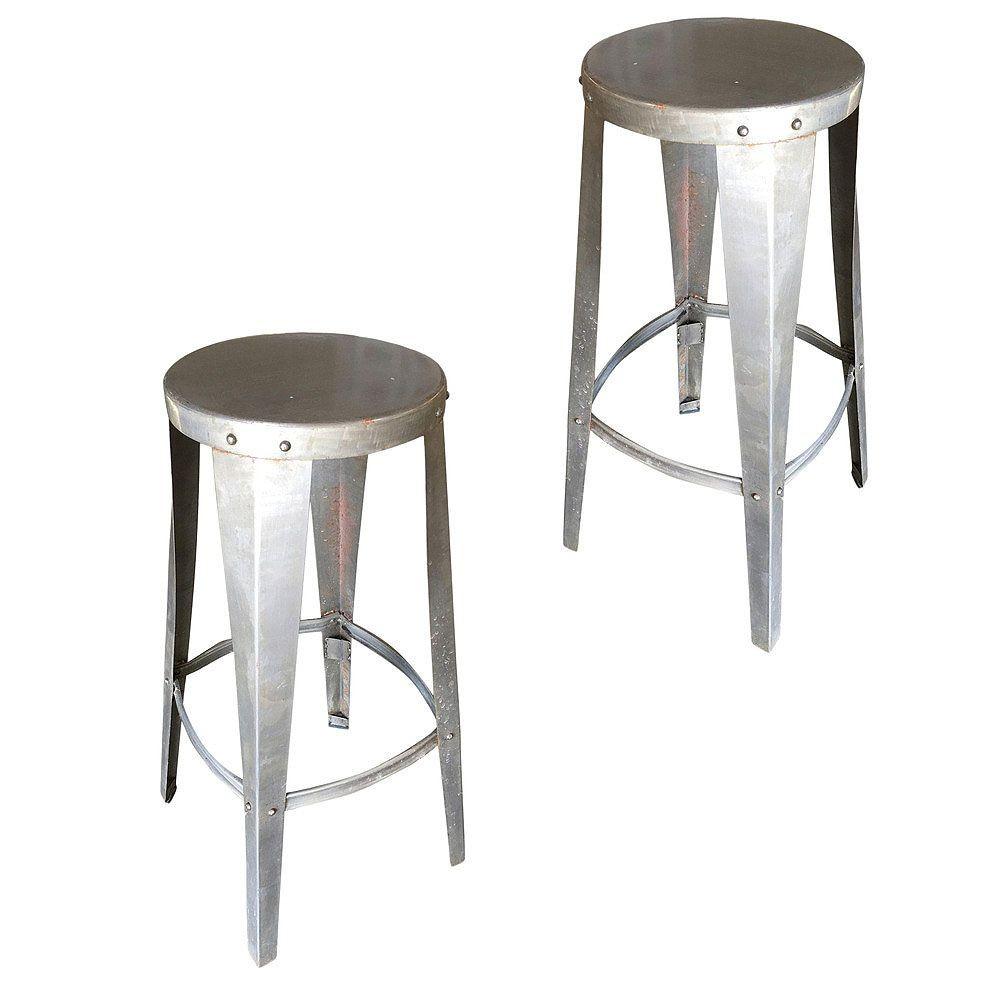 Pair of brushed steel Industrial Stools fashioned after the Tanker furniture manufacturers of the post WWII era, like Steel Case. The stools feature a round top and ring-shaped footrest. The stools have a nice postmodern look with a minor patina and
