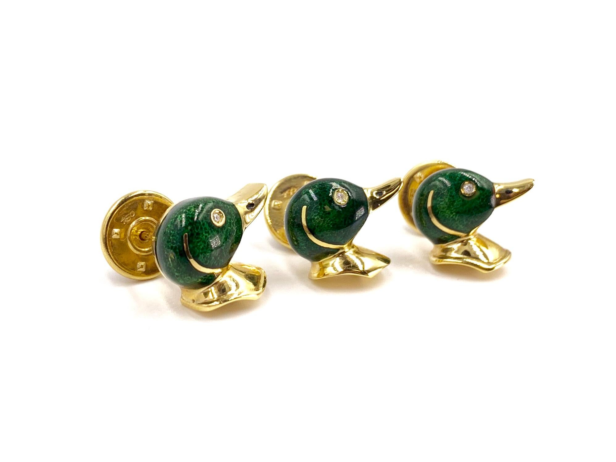 Made with superior quality by Tännler of Switzerland jewelry company. Set of 3 classic mallard duck head shirt studs made in 18 karat yellow gold with dark green enamel and a single round diamond eye. Signed with trademark on back of each