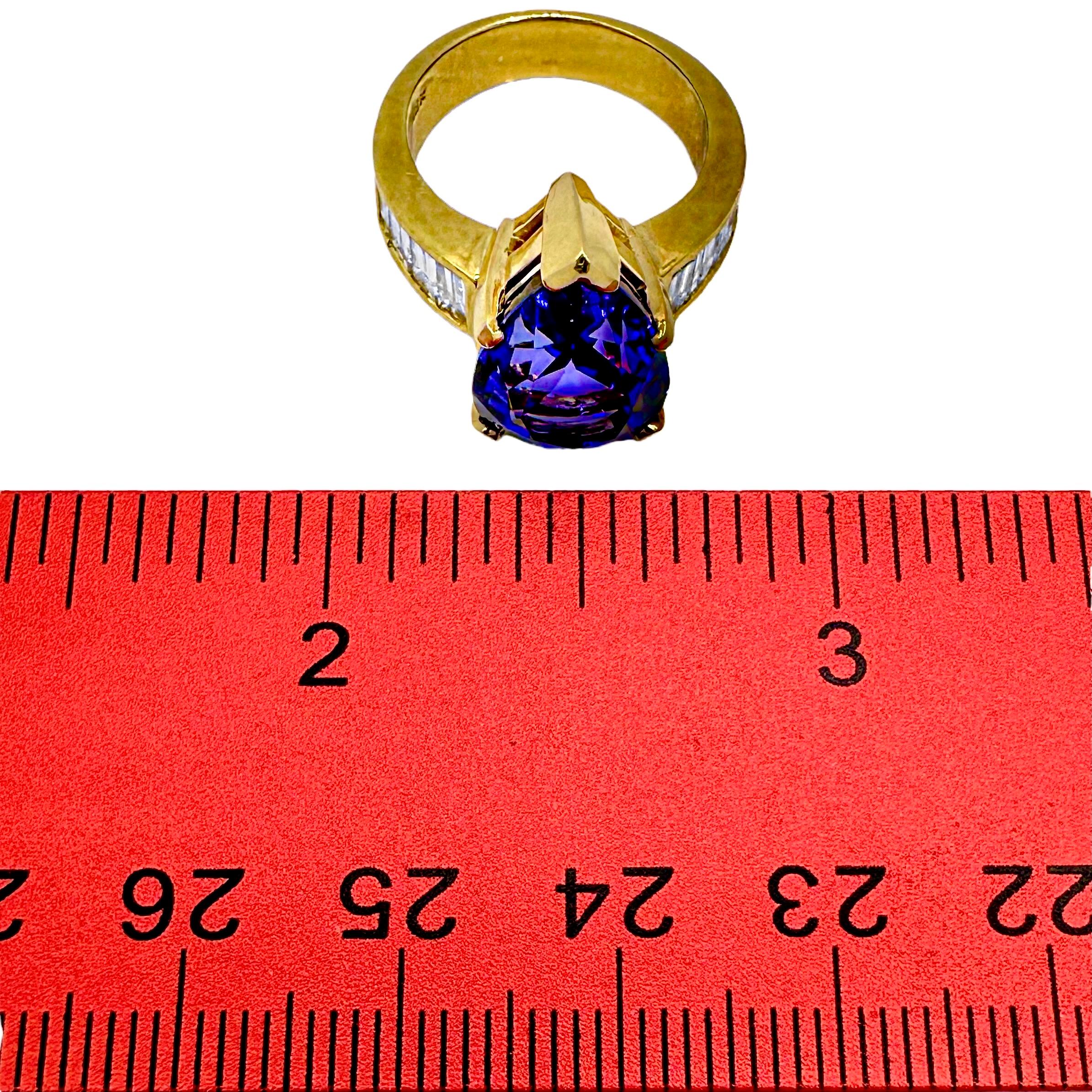 Tantalizing Pear Shaped Tanzanite Ring with Baguette Diamonds in 18K Yellow Gold For Sale 4