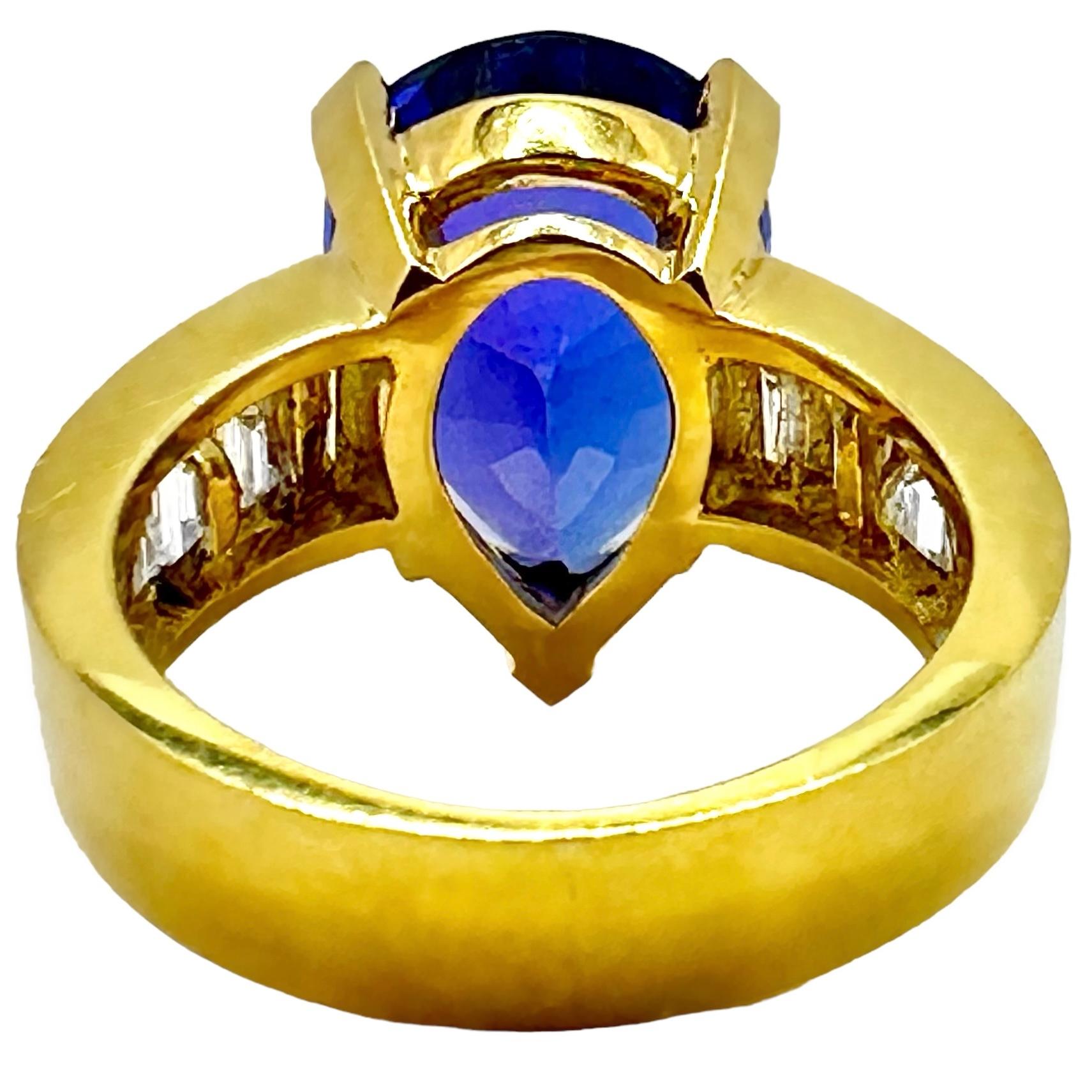 Modern Tantalizing Pear Shaped Tanzanite Ring with Baguette Diamonds in 18K Yellow Gold For Sale