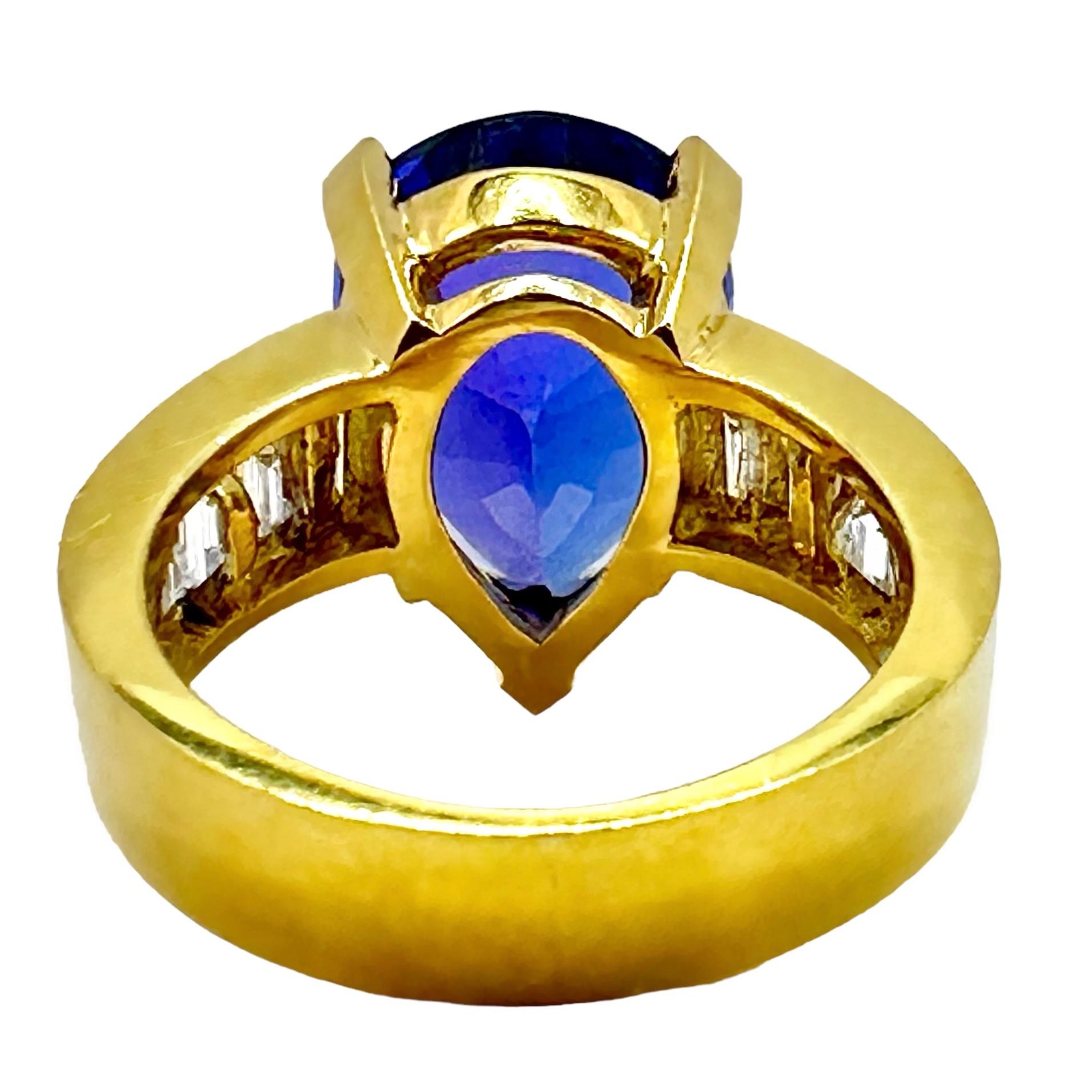 Women's Tantalizing Pear Shaped Tanzanite Ring with Baguette Diamonds in 18K Yellow Gold For Sale