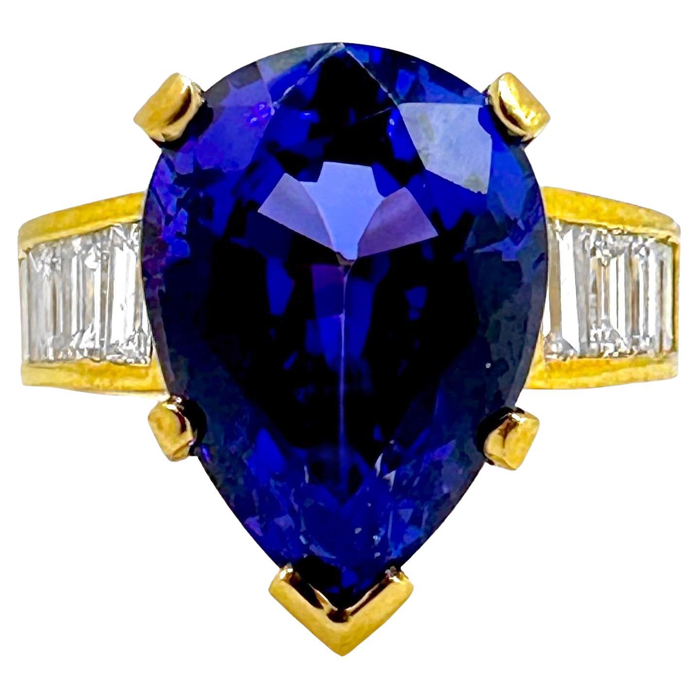 Tantalizing Pear Shaped Tanzanite Ring with Baguette Diamonds in 18K Yellow Gold For Sale