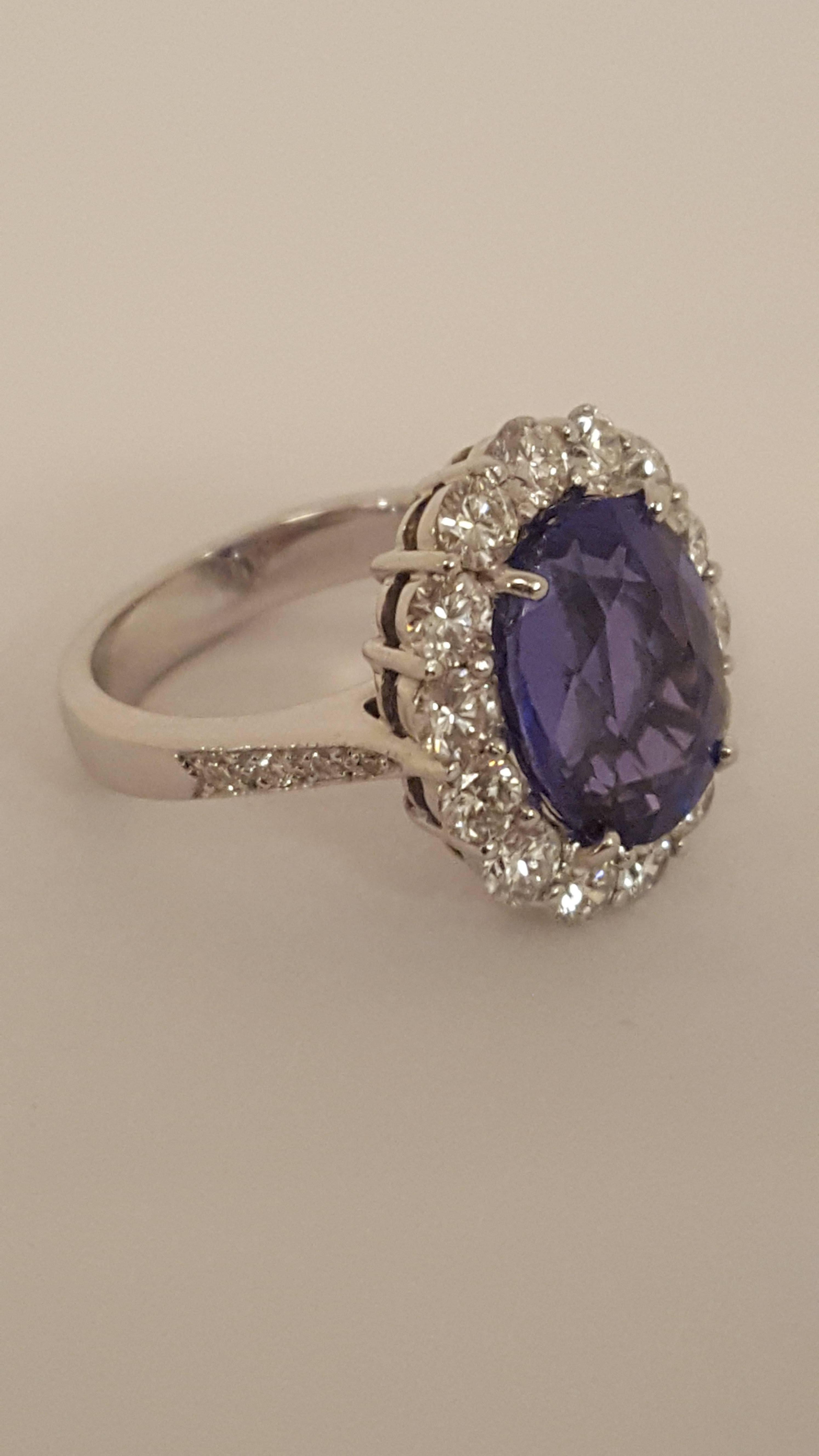 Purchased in 2001 from Neiman Marcus, this beautifully crafted 18 karat white gold ring boasts an oval, faceted tanzanite with a great deal of purple hues and even color saturation.  Tanzanite weighs in at 7.40 carats!  Impressive on its own but