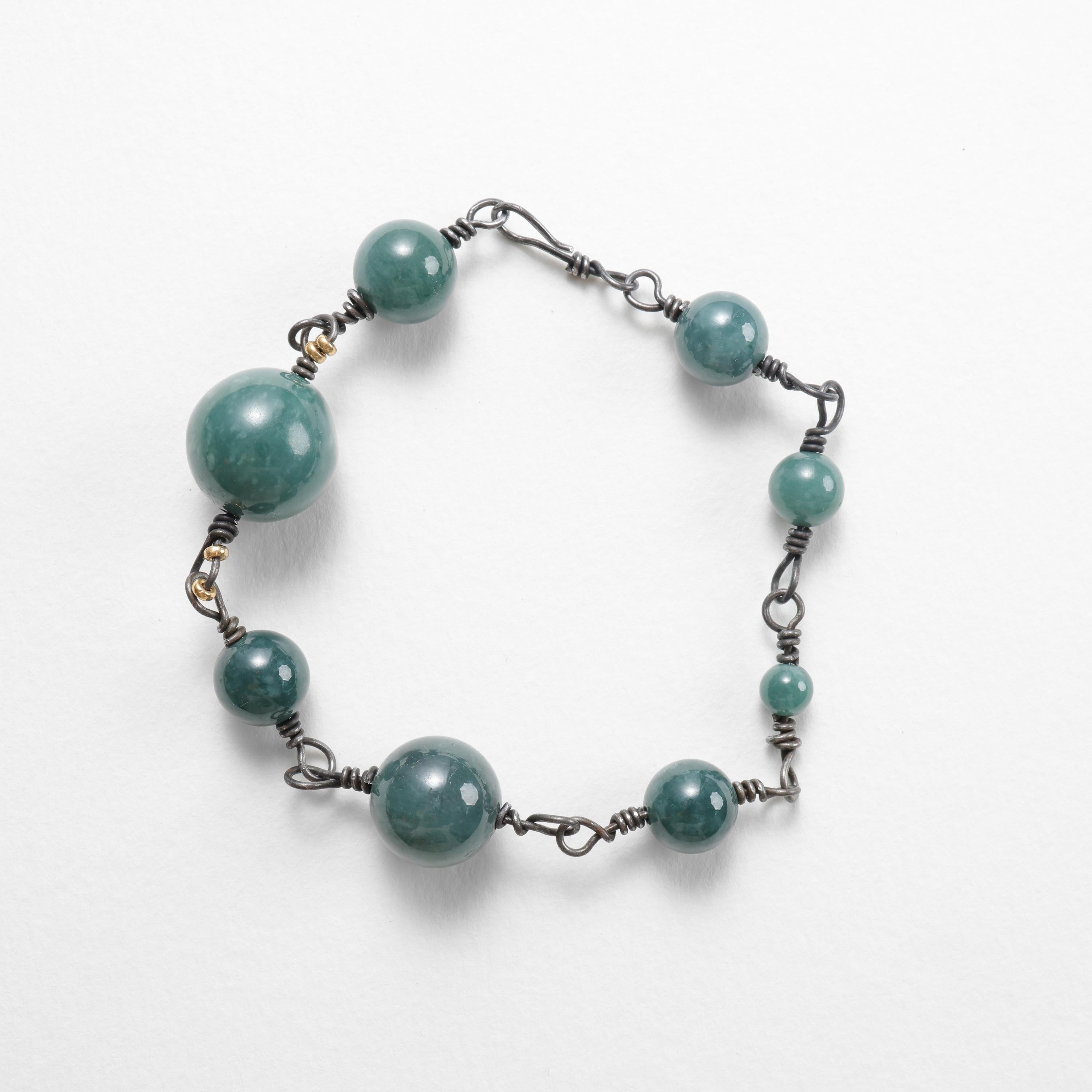 Tantalum and jadeite bracelet and necklace combination; rarer than rare.

The 11