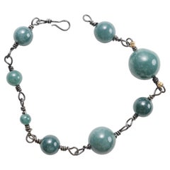 Ensemble de colliers et de bracelets en tantale et en jadéite