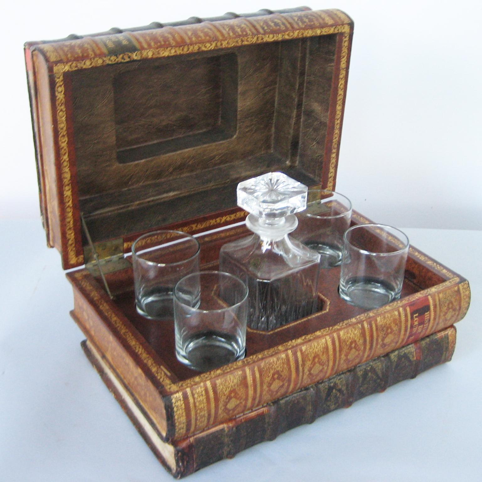 Large tantalus, hidden to appear as a stack of five books, its hinged lid opens to reveal the interior with a compartment dressed with a central liquor bottle and four old fashion glass tumblers. 

Can be displayed open or closed, and is a great