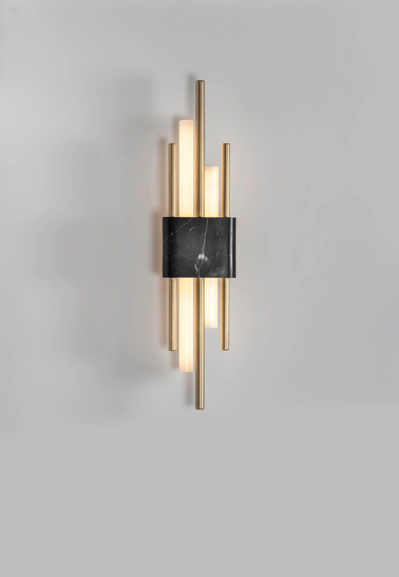 Tanto wall light, double, black marble by Bert Frank
Dimensions: 15 x 9 x H 65 cm
Materials: brushed brass, white carrara marble

When Adam Yeats and Robbie Llewellyn founded Bert Frank in 2013 it was a meeting of minds and the start of a