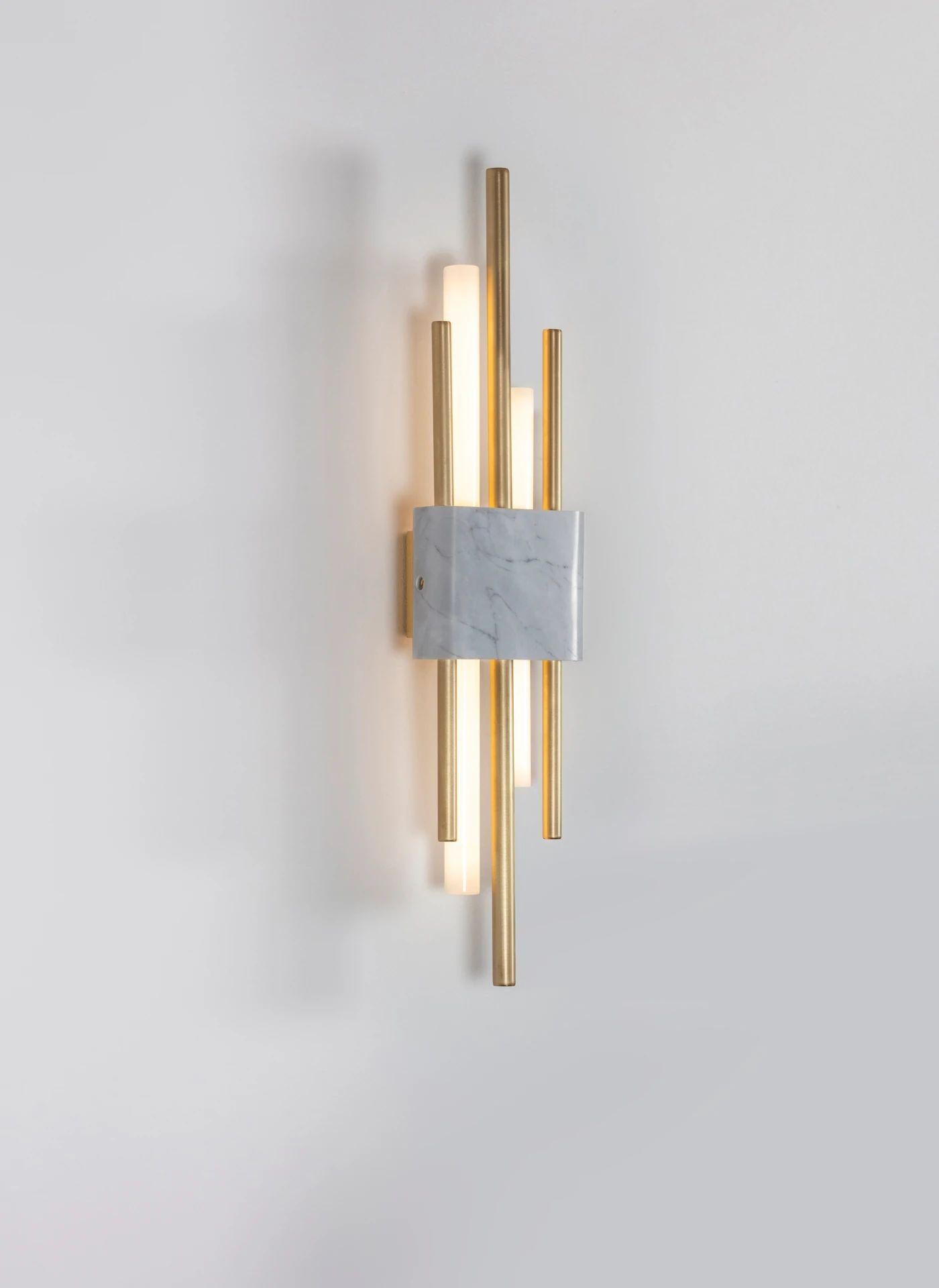 Tanto wall light, double, white marble by Bert Frank
Dimensions: 15 x 9 x H 65 cm
Materials: brushed brass, white carrara marble

When Adam Yeats and Robbie Llewellyn founded Bert Frank in 2013 it was a meeting of minds and the start of a