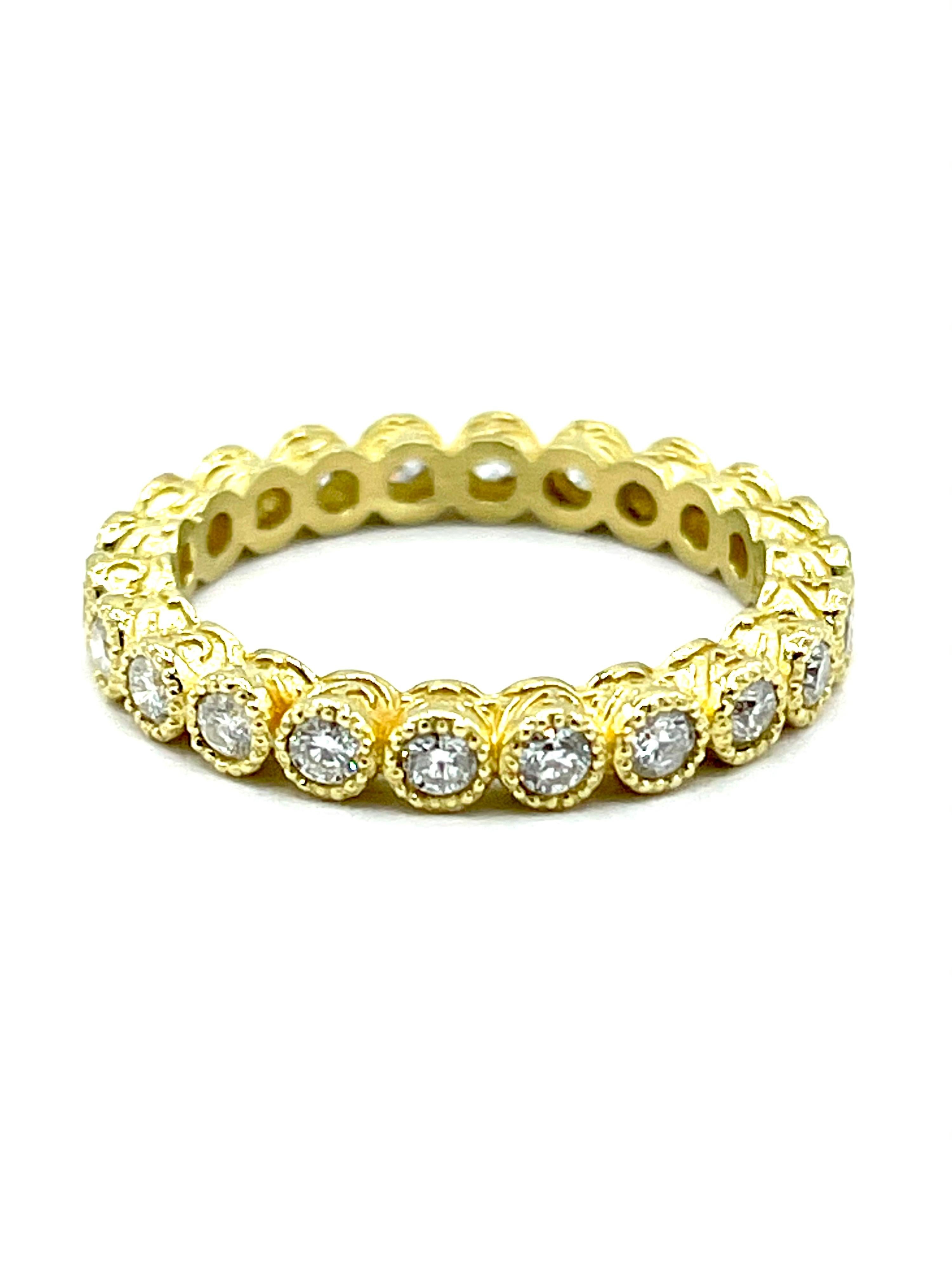 A beautifully handcrafted Tanya Farah Diamond eternity band.  All of the round brilliant cut Diamonds are bezel set with a beaded edge in 18K yellow gold hand engraved setting.  The Diamonds are 0.65 carats total and are graded as G-H color, VS