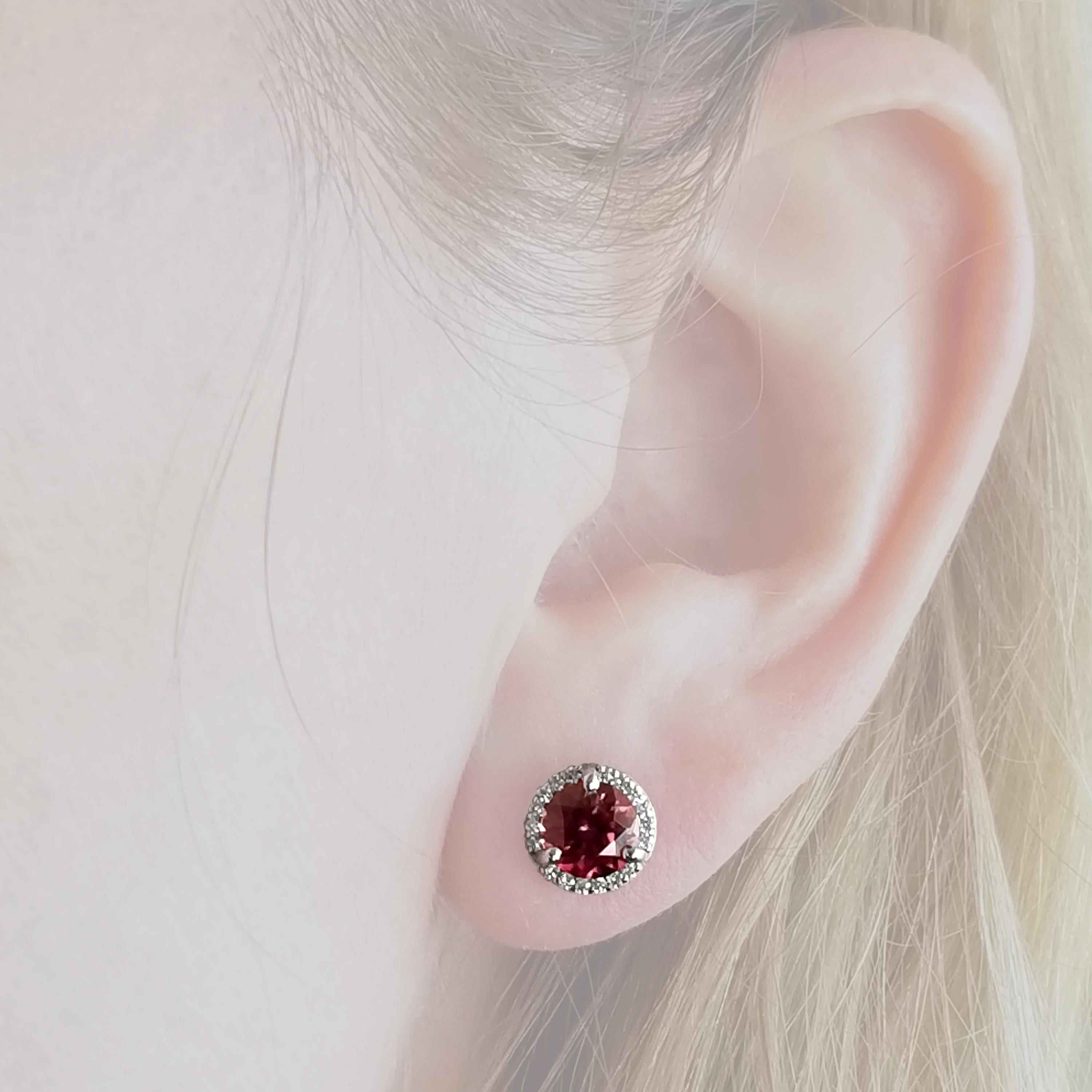 Pink Zircon from Tanzania command attention in these earrings; the natural liveliness of zircon and this wear-with-anything color makes for the perfect stud. A delicate halo of diamonds is perfectly balanced so as not to distract from or overwhelm