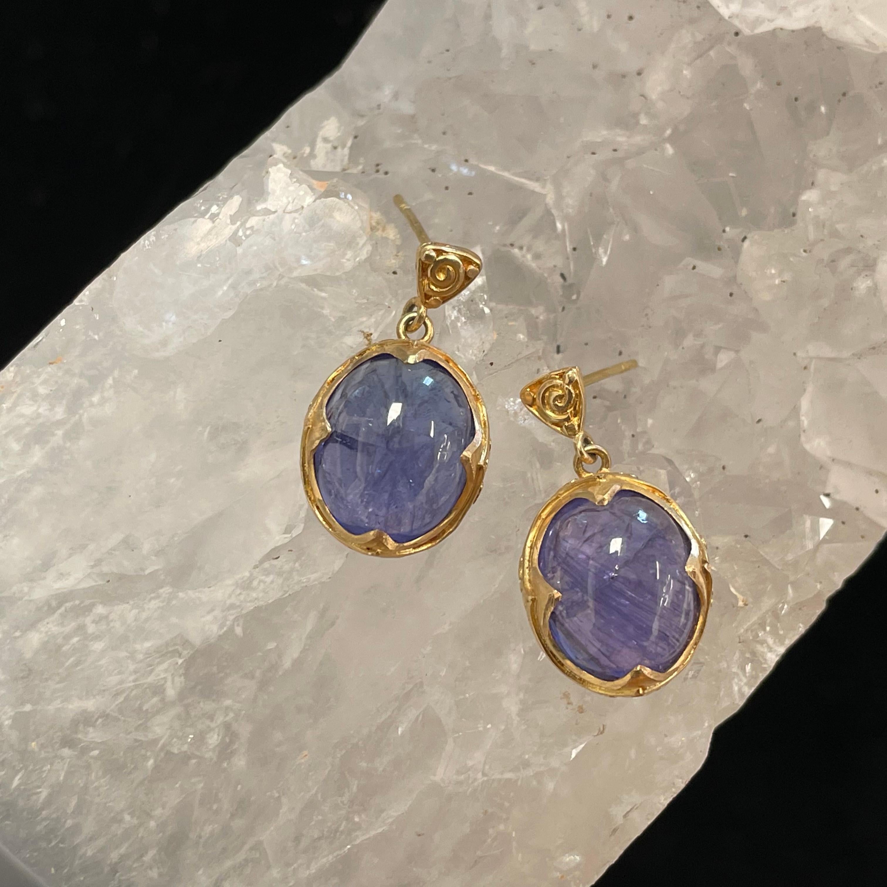 Two 10x12 mm Tanzanite cabochons are set in signature ancient-inspired 