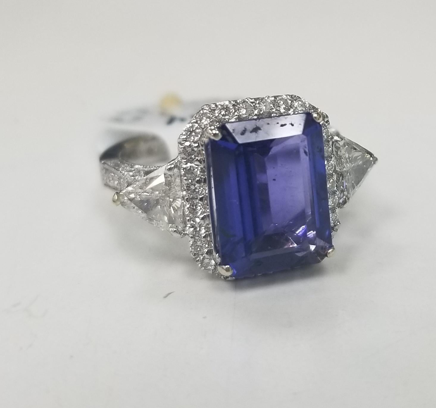 *Motivated to Sell – Please make a Fair Offer*
Specifications:
    main stone: Tanzanite Emerald-cut 3.53ct A-Quality 
    diamond; 2 trillion cut diamonds weighing .53pts. rounds .22pts.
    diamond; clarity: VS1-2
    diamond; color: G
   