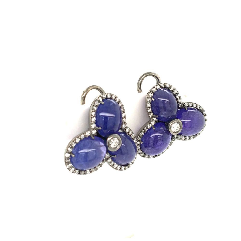 on the Ear clip earrings set with six cabochon cut tanzanite
and 0.78 Carats of round cut diamonds
18 KT gold, made in Italy , come in a box
the tanzanite are perfect matching stones in term of size and color
gold is oxidite to give additional