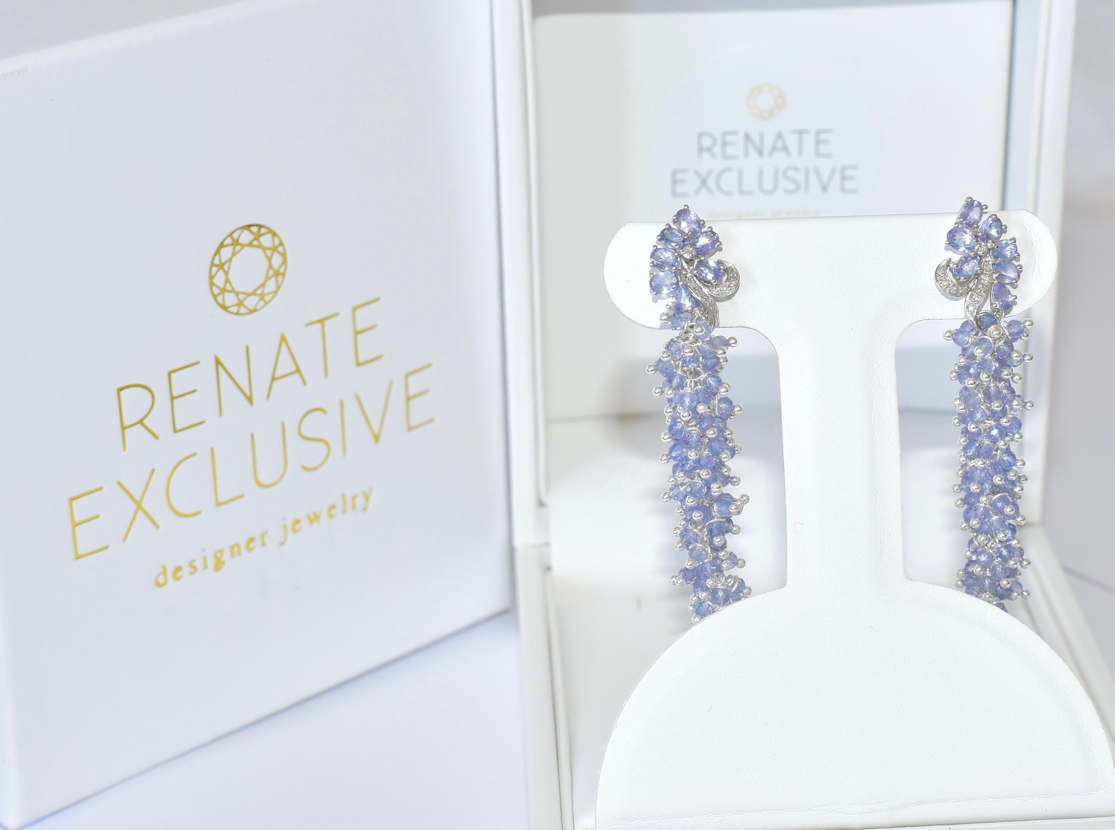 Elegant and rich Tanzanite is always eye-catching! Luxurious 14 k White Gold stud earring post is added dozens of Tanzanites beads. Incredible elegant and festive earrings for a special Lady! 