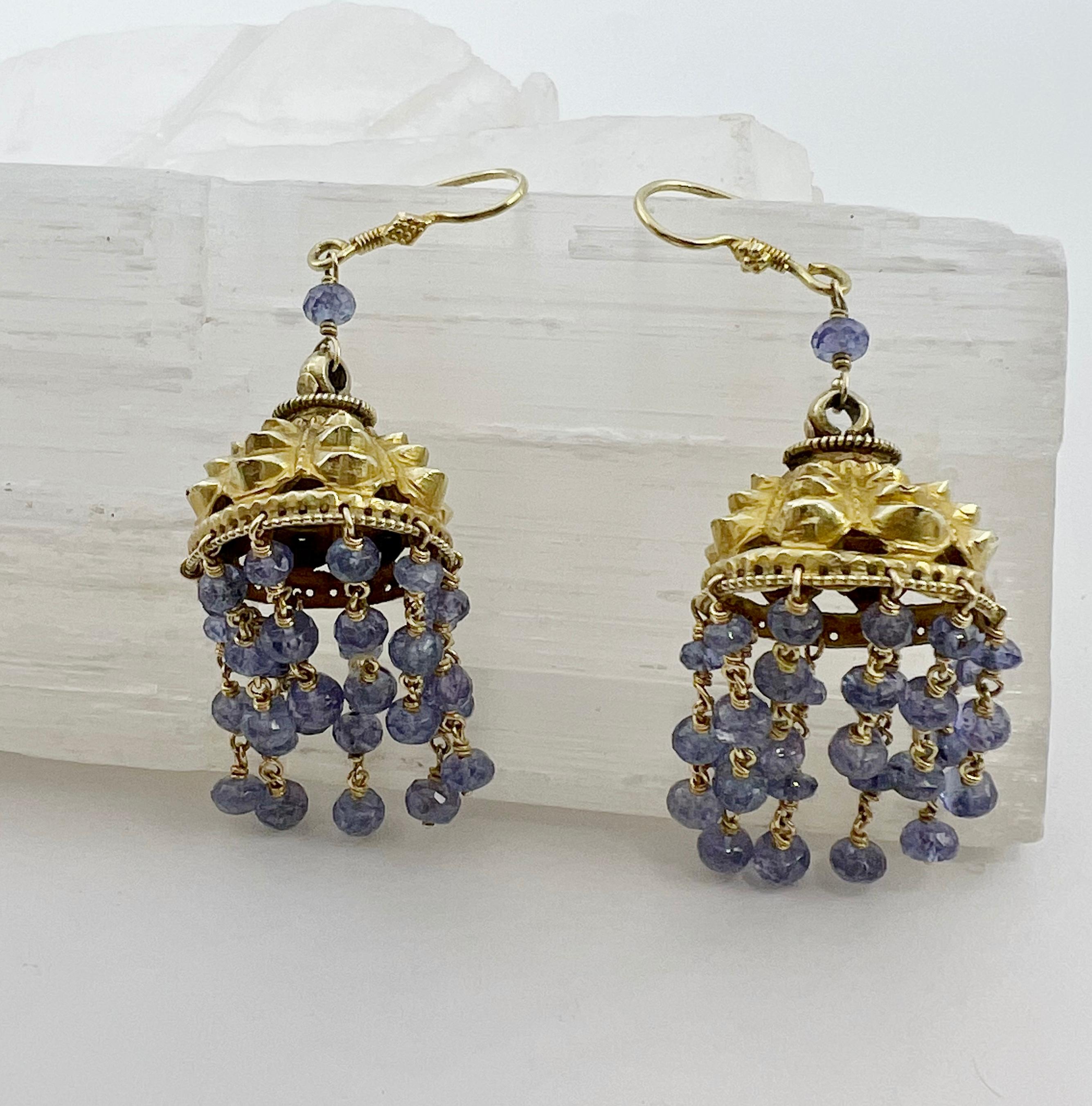 These beautiful Tanzanite and 18 karat gold earrings are reminiscent of a bird cage with a waterfall of movement form the cascading beads. They are very comfortable to wear and go with any outfit or color combination. 
