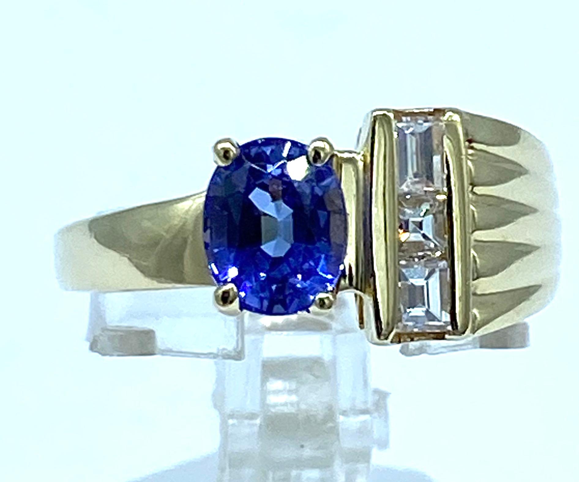 Contemporary Tanzanite and Baguette Diamond Ring 14 Karat Yellow Gold For Sale