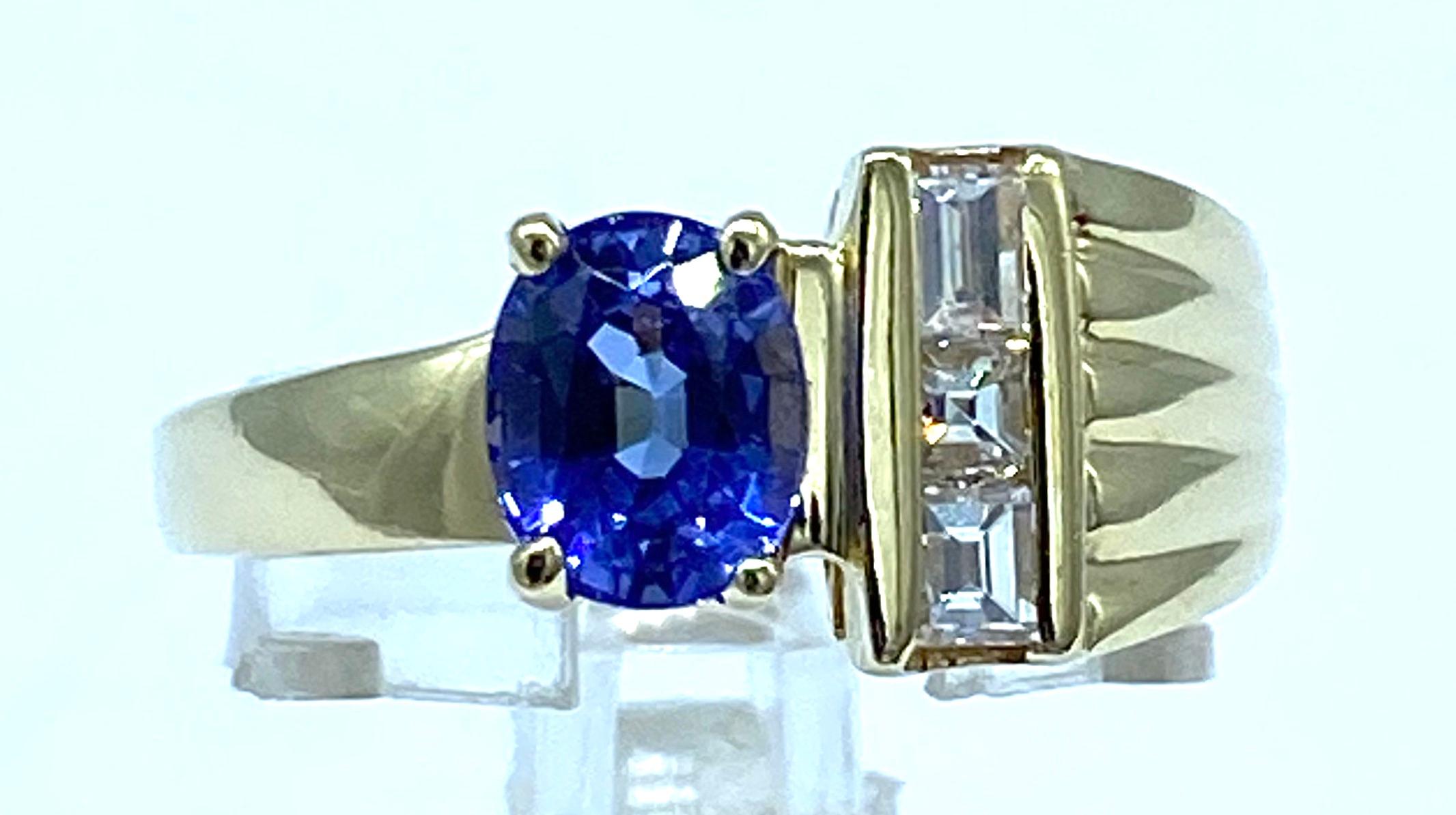 Oval Cut Tanzanite and Baguette Diamond Ring 14 Karat Yellow Gold For Sale