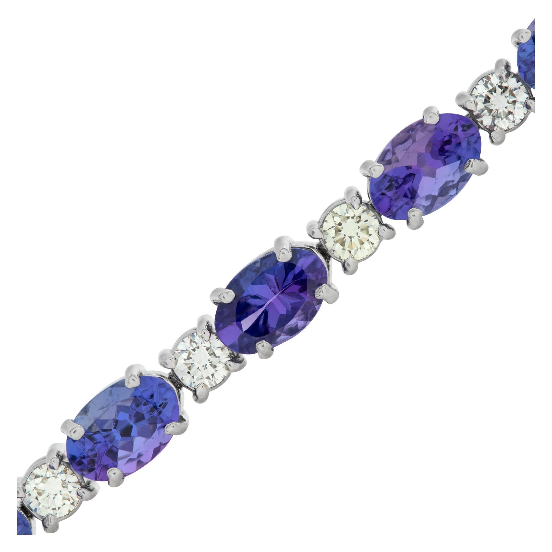 Tanzanite and diamond line bracelet in 14k white gold with 9.50 carats in oval tanzanites and 1.45 carats in round diamonds (H-I color, SI clarity). 7 inch length.
