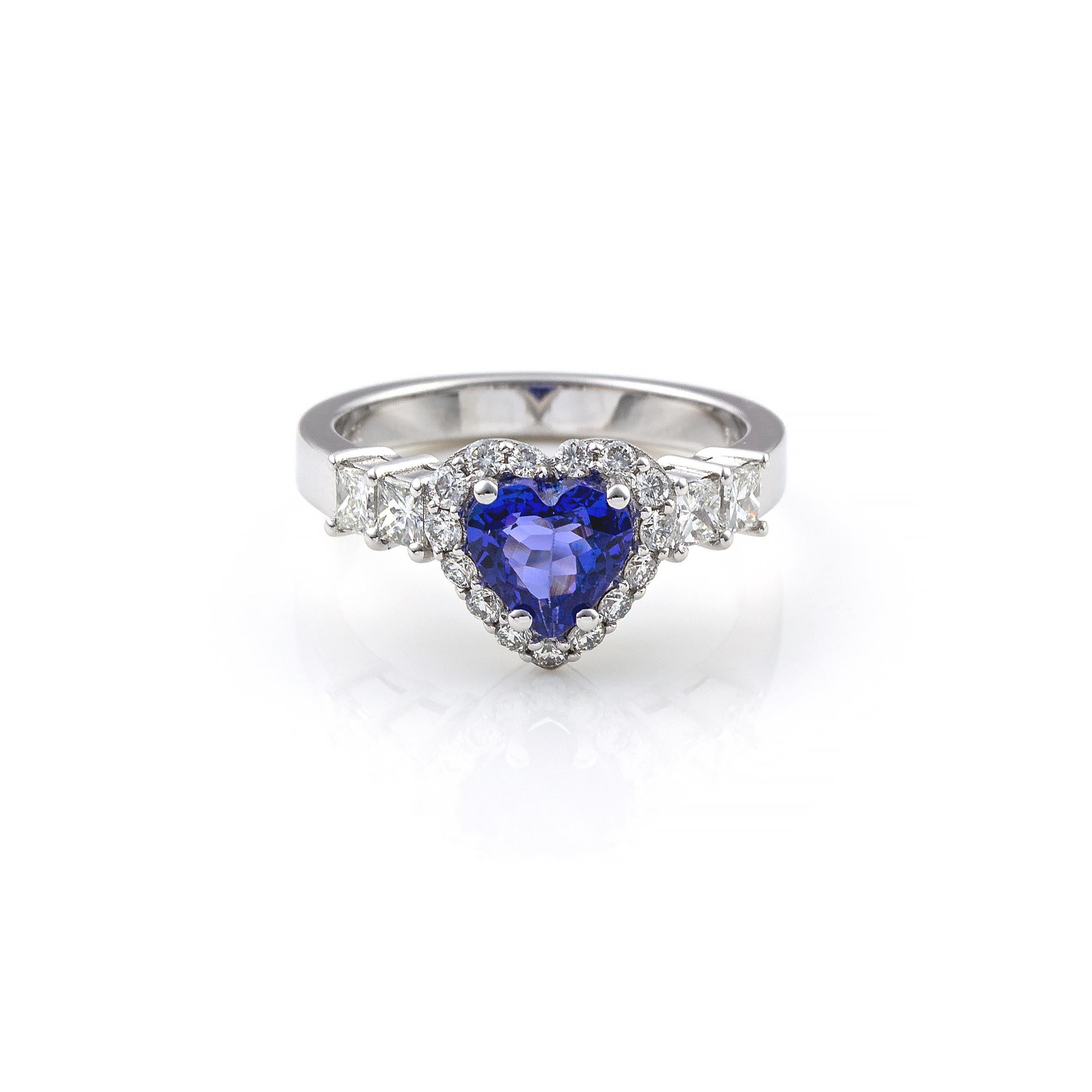 Beautiful ring in 18Kt white gold with tanzanite in heart shape and diamonds brilliant cut.
The ring has a prong setting and the tanzanite, has heart shape it is 1.45ct and it is surrounded by brilliant cut diamonds 0.34ct and four beautiful and