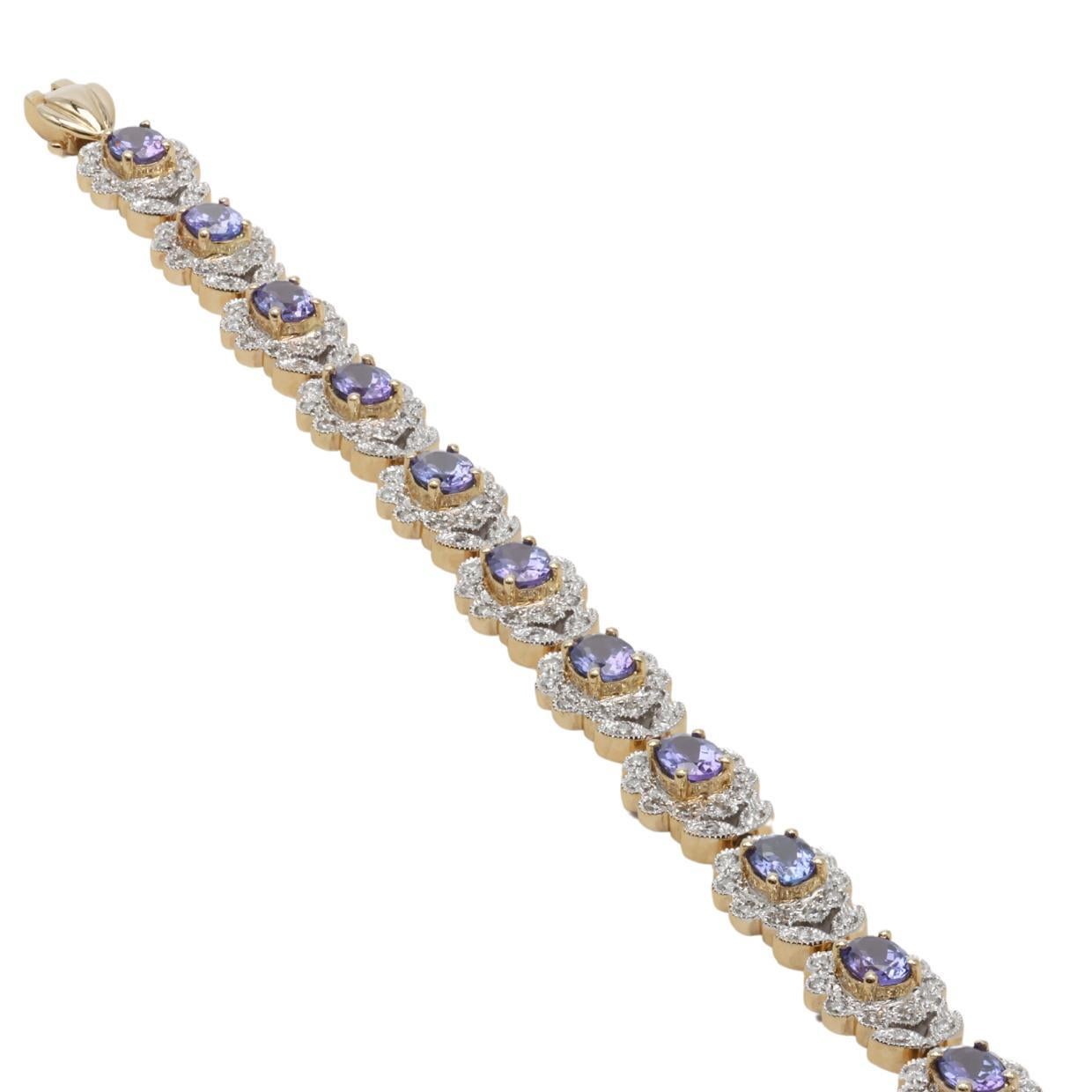 Oval Cut Tanzanite and Diamond Bracelet set in 14k Yellow Gold For Sale