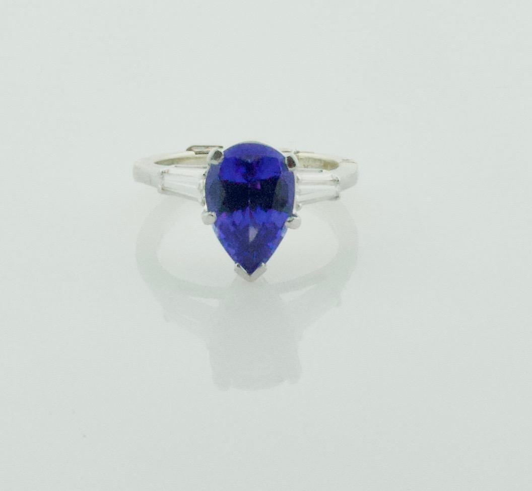 Women's or Men's Tanzanite and Diamond Classic Solitaire Ring in Platinum  For Sale