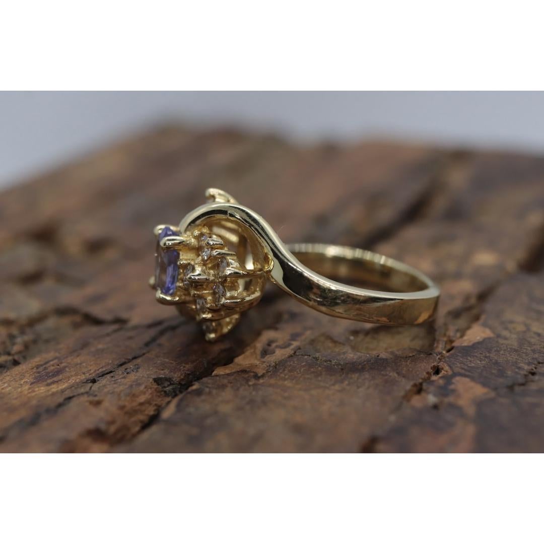 Tanzanite and diamond Cluster ring. 14k Blue Tanzanite and Diamond Halo Bypass In Good Condition For Sale In Port Charlotte, FL