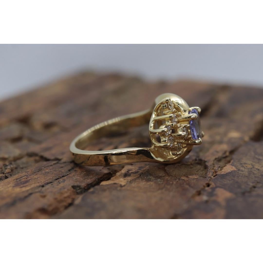 Tanzanite and diamond Cluster ring. 14k Blue Tanzanite and Diamond Halo Bypass For Sale 5