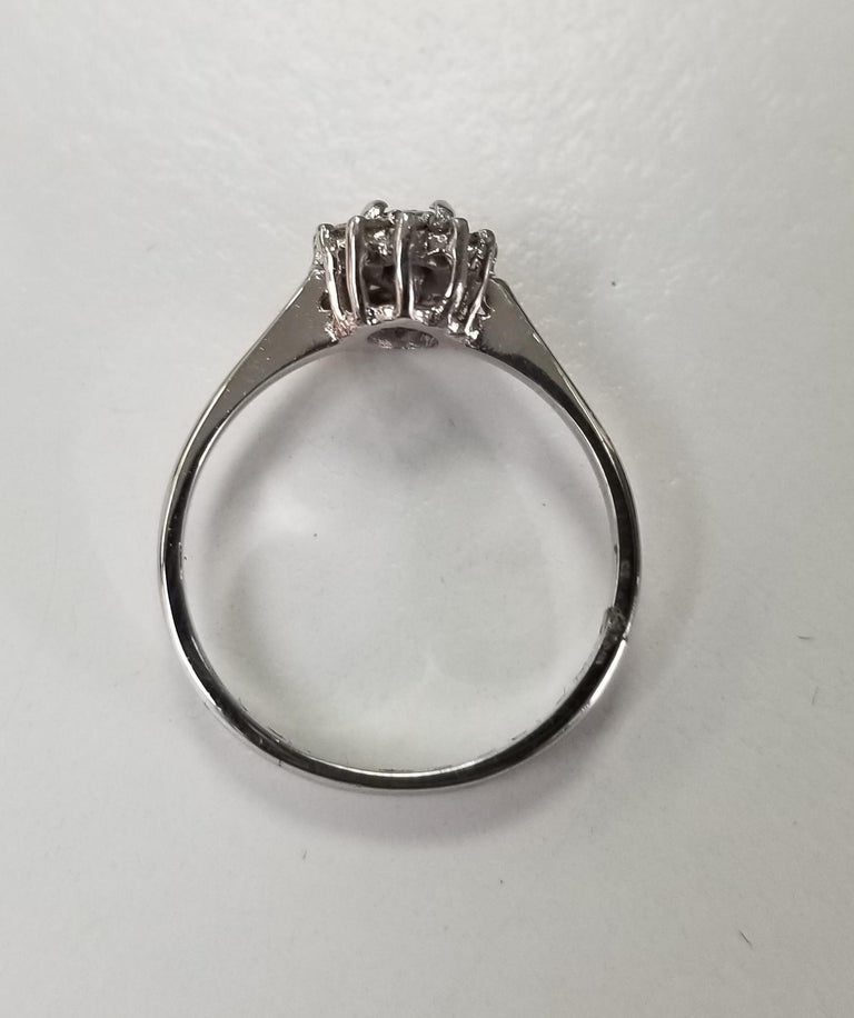 A pretty Tanzanite and Diamond cluster ring