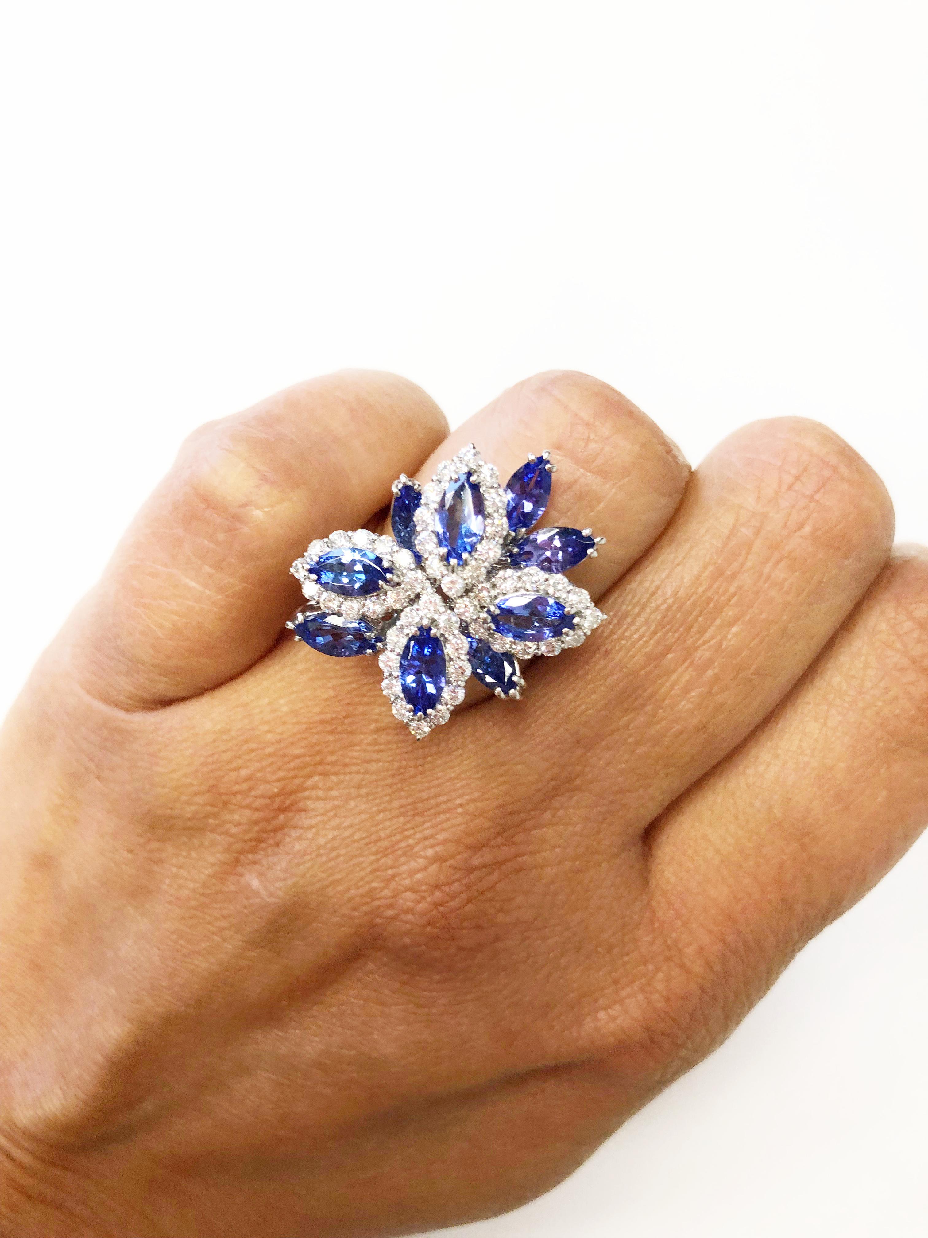 Beautiful tanzanite marquises weighing 3.13 carats, bright and perfect color! Good quality white diamonds weighing 0.90 carats.  Handcrafted platinum ring in size 6.75.  A fun ring that can be worn for any occasion!


