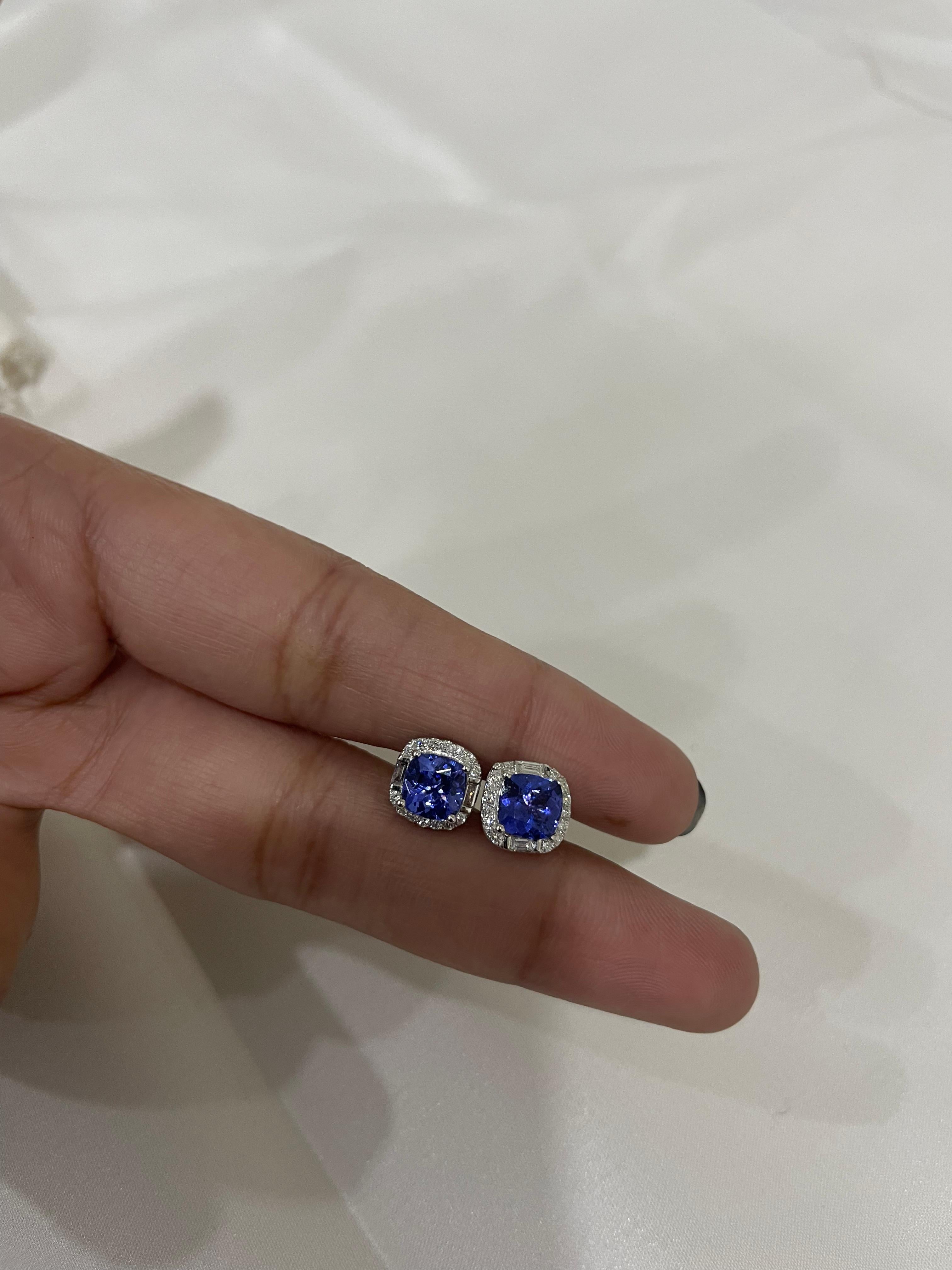 Studs create a subtle beauty while showcasing the colors of the natural precious gemstones and illuminating diamonds making a statement.

Cushion cut tanzanite studs with diamonds in 18K gold. Embrace your look with these stunning pair of earrings
