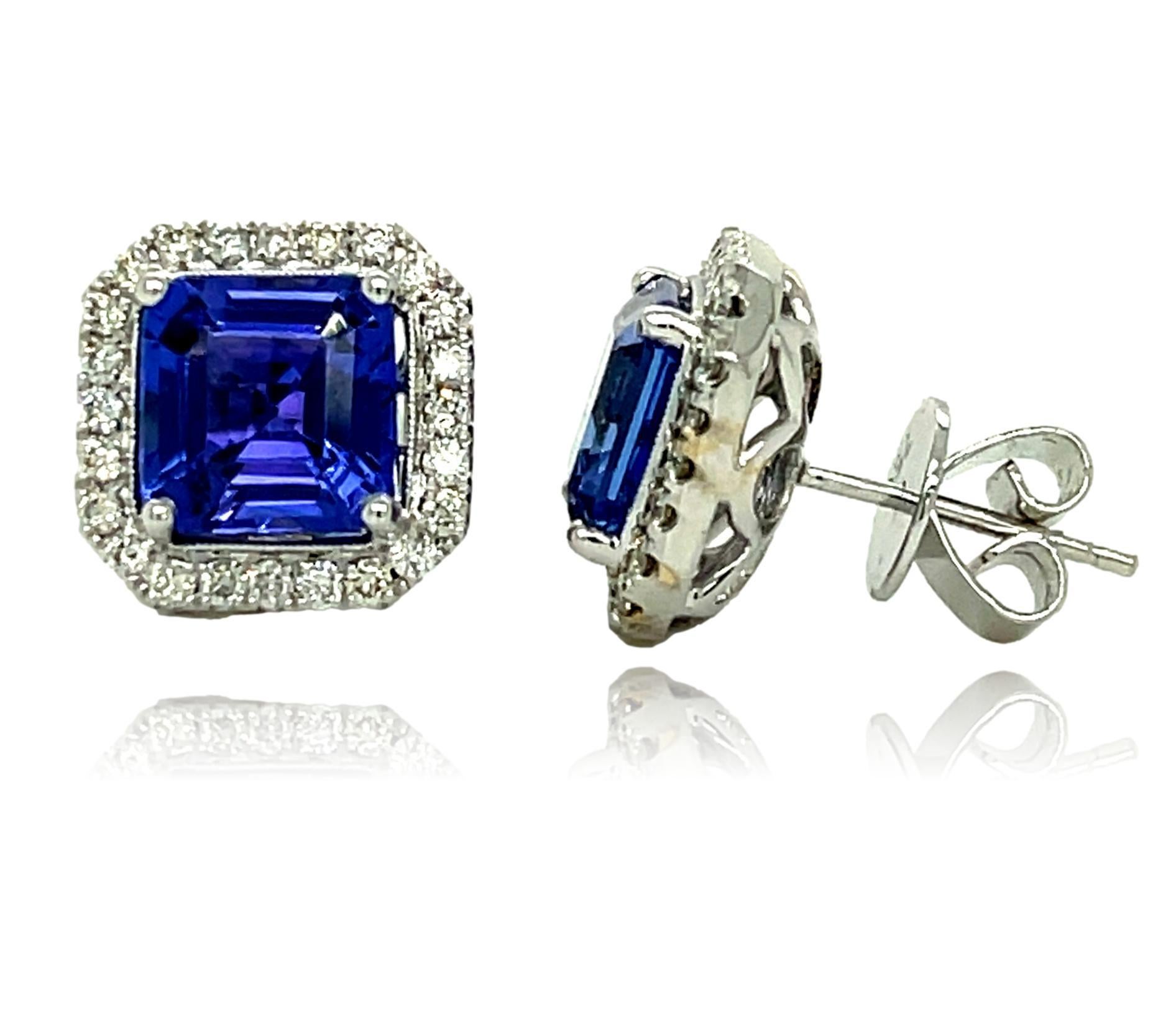 These stunning AAA Tanzanite stud earrings are surrounded by shimmering diamonds. There is a double push lock for extra security. These earrings have detailed tags attached and come in a beautiful box ready for the perfect gift!

14KW:           