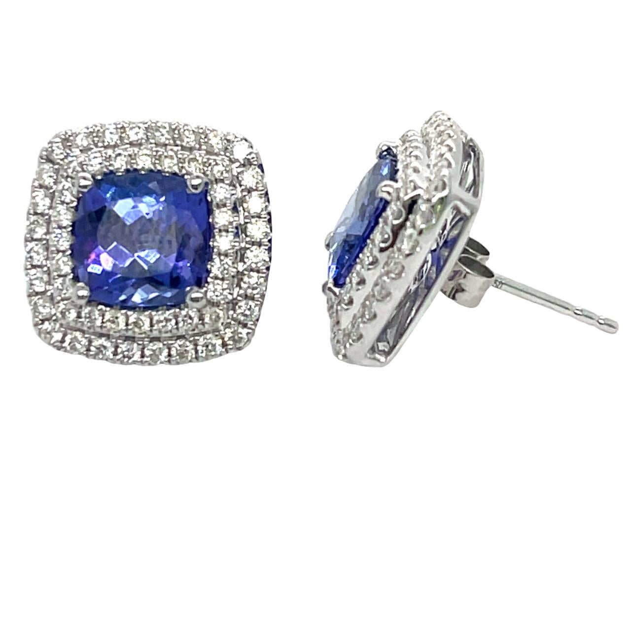 These stunning natural AAA Tanzanite stud earrings are surrounded by two halos of shimmering brilliant cut diamonds. There is a double push lock for extra security. These earrings have detailed tags attached and come in a beautiful box ready for the