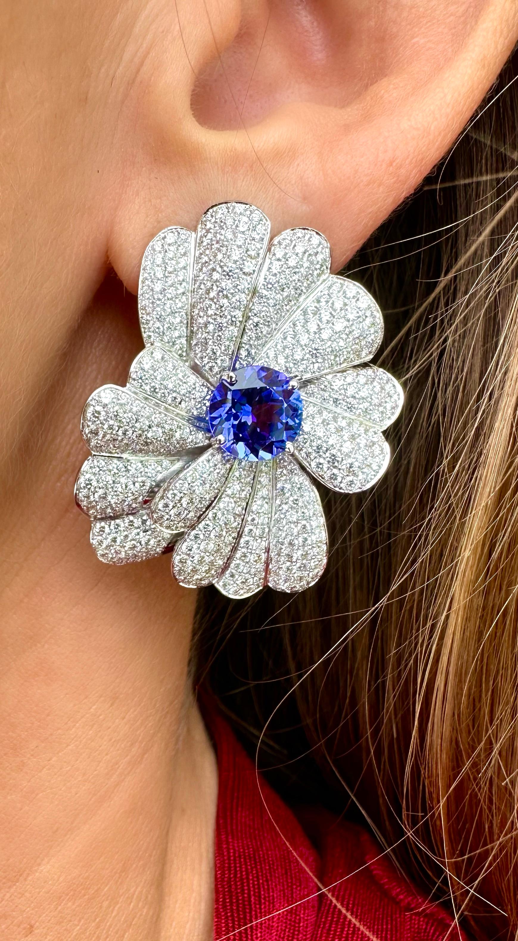 A white gold drop earrings made by Rosior in Portugal and set with:
- 2 round cut Tanzanites weighing 4,30 ct;
- 798 brilliant cut Diamonds (F-VVS)* weighing 5,33 ct.
*Color and Clarity certification provided by IGI.
Weight in 19.2K Gold:  16.2