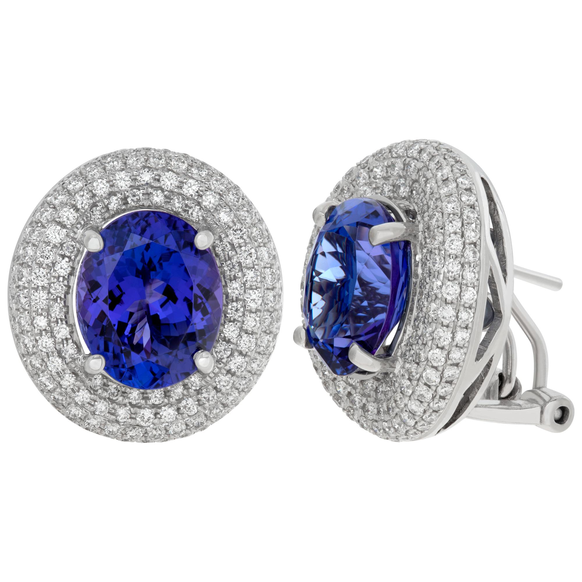 Tanzanite and diamond earrings with 1.19 carats in pave set G-H color, VS-SI clarity diamonds and 7.15 carats in oval tanzanites. 16.5 mm x 17.5 mm.
